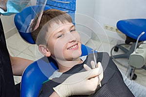 A young patient at the dentistÃ¢â¬â¢s consultation photo